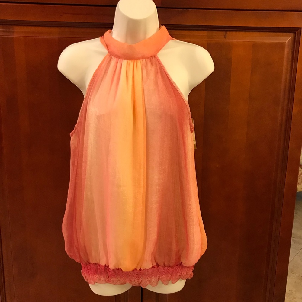 Sleeveless blouse in pink and coral.